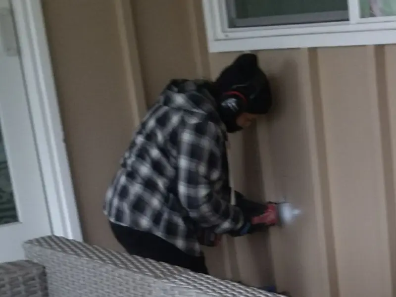 Professional electrician installing an exterior outlet in Blakely